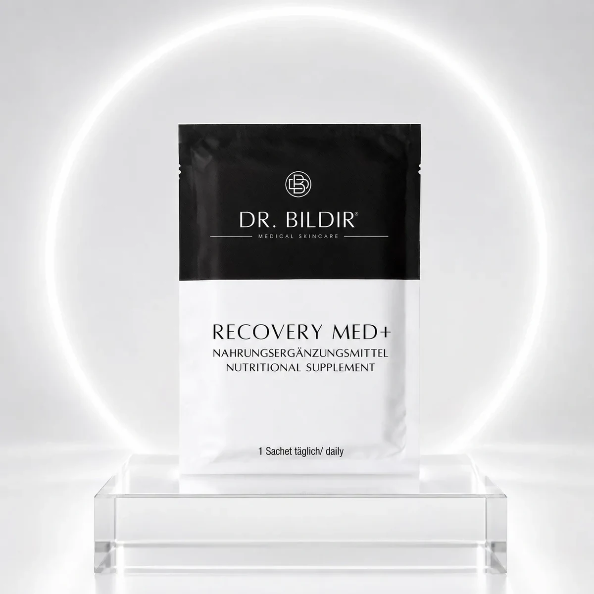 Dr. BILDIR RECOVERY MED+ Nahrungsergänzungsmittel Sachet vor hellem Lichtring